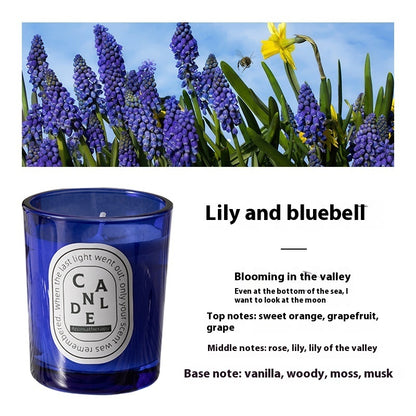 Detailed scent notes for Lily And Bluebell Flower Blue candle: Top notes: sweet orange, grapefruit, grape; middle notes: rose, lily, lily of the valley; base notes: vanilla, woody, moss, musk.