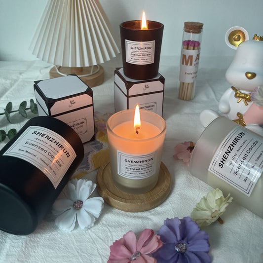 Lit Delphy Companion Gift Candle in glass creating a warm and cozy romantic atmosphere.