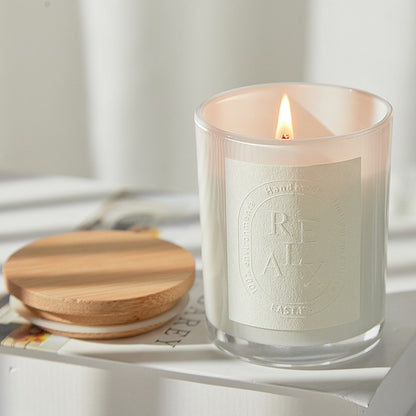 Close-up of a steady, smokeless flame on a Delphy aromatherapy candle to show clean-burning quality.