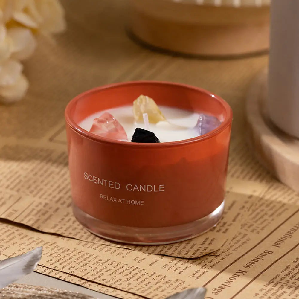 Charnay's Flower Orange Fresh Essential Oil Soy Wax Candle in an orange glass cup
