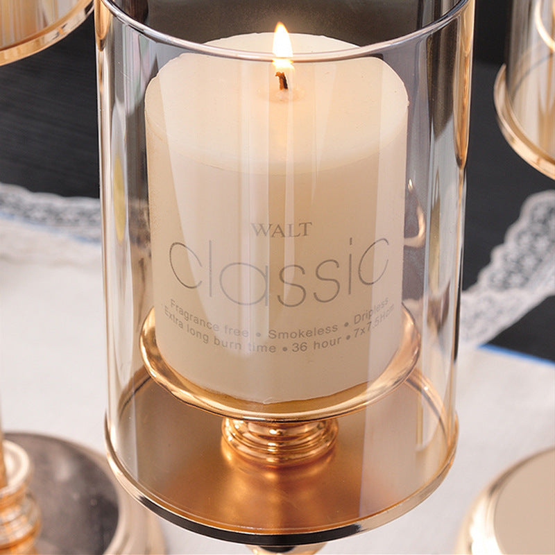 Delphy metal candle holder supporting a lit soy wax candle, creating a cozy and elegant atmosphere.