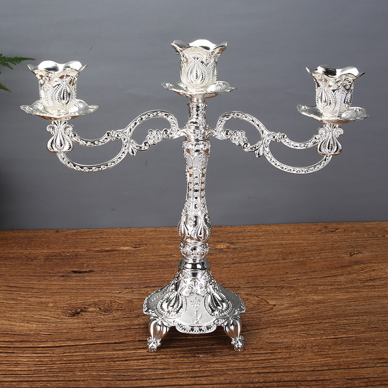 Elegant 3-arm silver zinc alloy candle holder featuring tulip-shaped candle cups and an embossed floral base. exclude-gallery