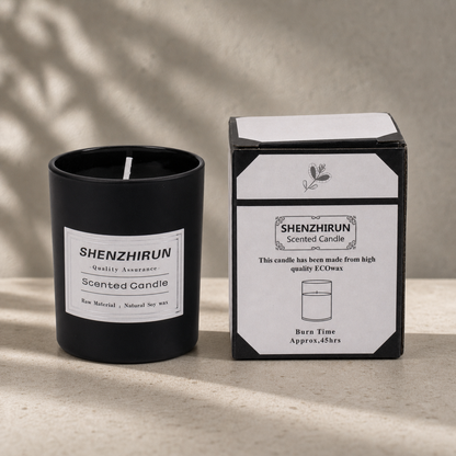 Black frosted Stress Relief Soy Candle in the large eight by seven centimetre cup beside its forty five hour packaging.