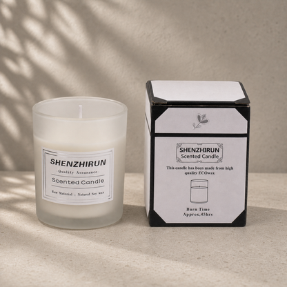 White frosted Stress Relief Soy Candle in the large eight by seven centimetre cup beside its forty five hour packaging.