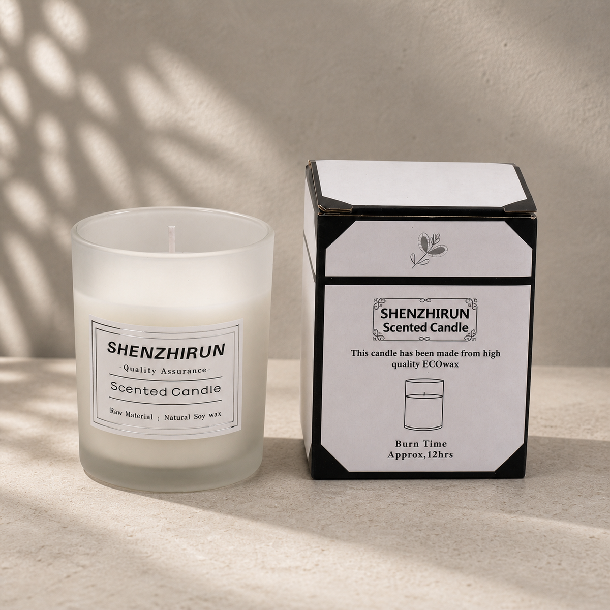White frosted Stress Relief Soy Candle in the small six by five centimetre cup beside its twelve hour packaging.