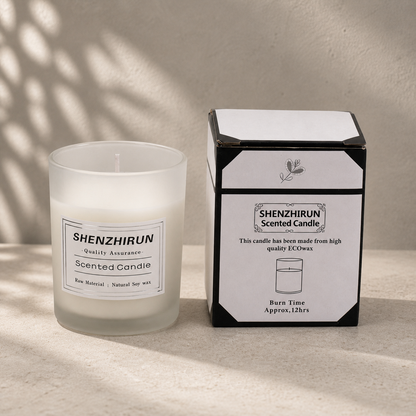 White frosted Stress Relief Soy Candle in the small six by five centimetre cup beside its twelve hour packaging.