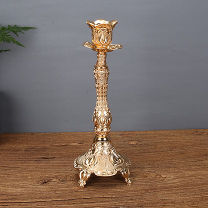 A tall, slender gold tulip single taper candle holder made of premium zinc alloy for minimalist luxury home decor.