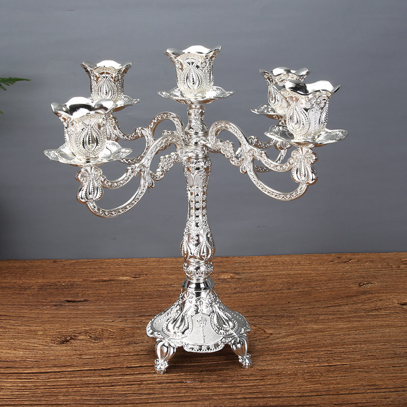 A vintage silver-finished tulip candle holder made of zinc alloy, featuring five decorative arms for taper candles.